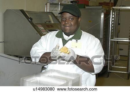 Man with disabilities working in a food store. View Large Photo Image Stock Image - Man with disabilities working in a food store.. Fotosearch