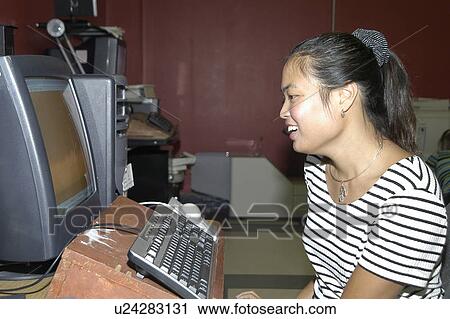 Woman with a disability in an office using a computer View Large Photo Image Stock Image - Woman with a disability in an office using a computer. Fotosearch