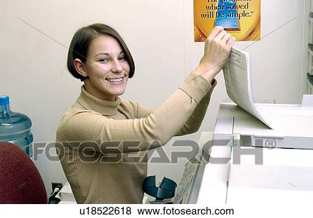Woman with a disability, utilizing crutches to assist with mobility, making copies of documents as a part of her daily duties at work. View Large Photo Image Stock Photo - Woman with a disability, utilizing crutches to assist with mobility, making copies of documents as a part of her daily duties at work.. Fotosearch