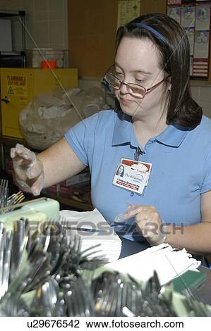 Woman with DownÆs Syndrome working in the food service industry. View Large Photo Image Stock Image - Woman with DownÆs Syndrome working in the food service industry.. Fotosearch