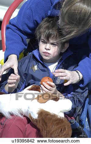 Boy with autism plays with Mom View Large Photo Image Stock Image - Boy with autism plays with Mom. Fotosearch