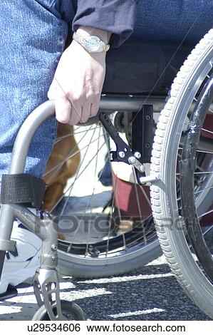 Stock Photograph - Hand control of wheelchair use. Fotosearch