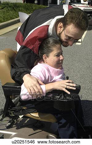 Husband Jokes With Wife Wheelchair User Stock Photograph
