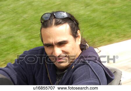 Man with a disability utilizing a wheelchair for mobility. View Large Photo Image Stock Photo - Man with a disability utilizing a wheelchair for mobility.. Fotosearch