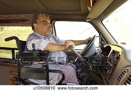 Man with a mobility impairment driving a van equipped with hand controls. View Large Photo Image Stock Image - Man with a mobility impairment driving a van equipped with hand controls.. Fotosearch
