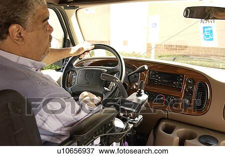 Man with a mobility impairment driving his van equipped with hand controls. View Large Photo Image Stock Photo - Man with a mobility impairment driving his van equipped with hand controls.. Fotosearch