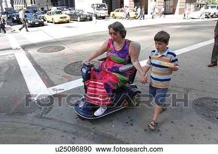 Mother and son crossing a street in New York City while vacationing there. View Large Photo Image Stock Image - Mother and son crossing a street in New York City while vacationing there.. Fotosearch