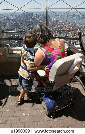 Mother and son with disabilities sightseeing while on vacation. View Large Photo Image Stock Image - Mother and son with disabilities sightseeing while on vacation.. Fotosearch