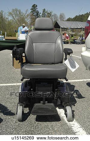Power wheelchair displayed at community event View Large Photo Image Stock Photo - Power wheelchair displayed at community event. Fotosearch