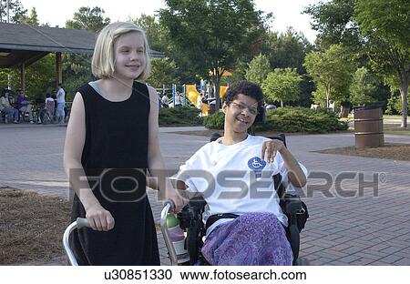 Two girls with disabilities just hanging out and having a great time. View Large Photo Image Stock Image - Two girls with disabilities just hanging out and having a great time.. Fotosearch
