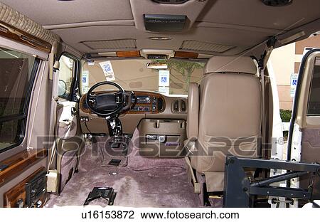 Stock Image - Van equipped with hand controls to allow a person with no leg/foot movement abilities to drive a van.. Fotosearch