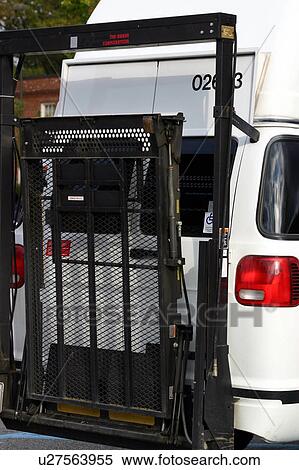Stock Photography - Wheelchair lift attached to the rear of a van.. Fotosearch