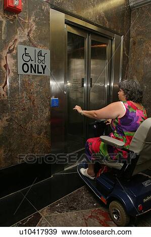 Woman going into an accessible bathroom. View Large Photo Image Stock Photo - Woman going into an accessible bathroom.. Fotosearch