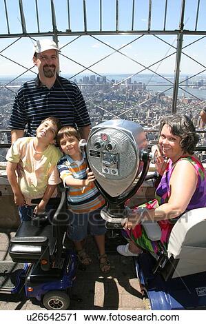 A family of four having fun on vacation. View Large Photo Image Stock Image - A family of four having fun on vacation.. Fotosearch