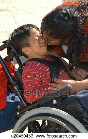 A moment captured between a little boy with multiple disabilities and his mother. View Large Photo Image Stock Image - A moment captured between a little boy with multiple disabilities and his mother.. Fotosearch