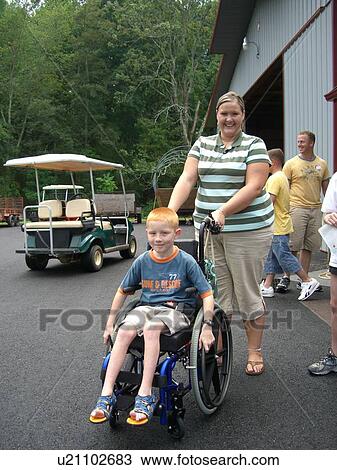 Boy, in wheelchair, with Woman, at camp. View Large Photo Image Stock Image - Boy, in wheelchair, with Woman, at camp.. Fotosearch