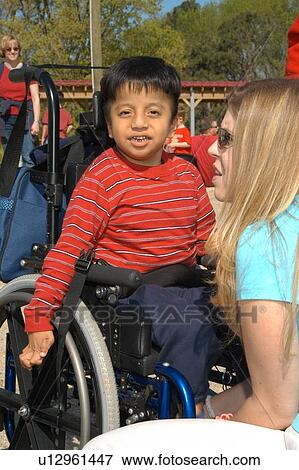 Little boy with a disability, utilizing a wheelchair for mobility, preparing to visit a petting zoo. View Large Photo Image Stock Photo - Little boy with a disability, utilizing a wheelchair for mobility, preparing to visit a petting zoo.. Fotosearch