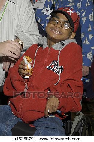 Stock Image - Little boy with multiple disabilities posing for the camera.. Fotosearch