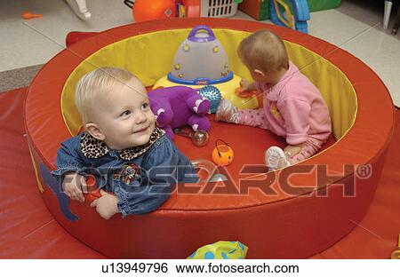 Stock Photograph - Adorable children playing at school. Children of various disabilities playing together at school.. Fotosearch
