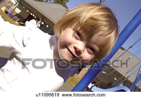 Adorable image of a little girl with a disability enjoying swinging during recess. View Large Photo Image Stock Photo - Adorable image of a little girl with a disability enjoying swinging during recess.. Fotosearch