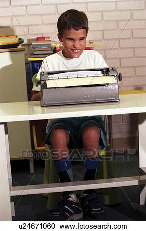 Cute little boy with multiple disabilities, including blindness, using a braille machine as he learns to type a letter. View Large Photo Image Stock Image - Cute little boy with multiple disabilities, including blindness, using a braille machine as he learns to type a letter.. Fotosearch