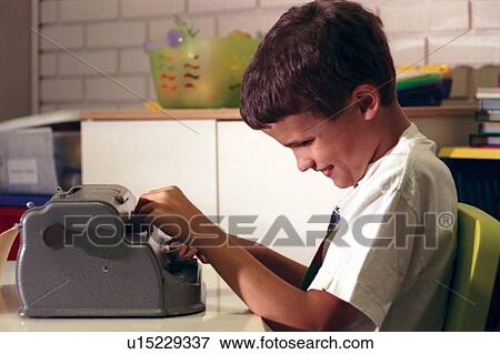 Cute little boy with multiple disabilities, including blindness, using a braille machine as he learns to type a letter. View Large Photo Image Stock Photo - Cute little boy with multiple disabilities, including blindness, using a braille machine as he learns to type a letter.. Fotosearch