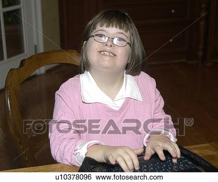 Girl with Down Syndrome clowning around and having fun. View Large Photo Image Stock Photograph - Girl with Down Syndrome clowning around and having fun.. Fotosearch