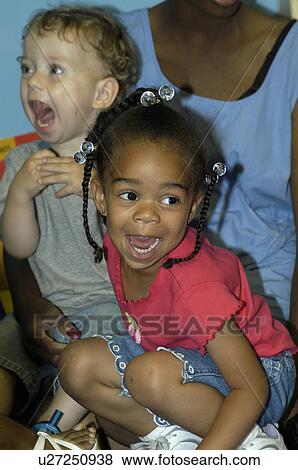 Stock Photo - Some of the happiest children you could ever hope to meet! Both children have disabilities.. Fotosearch