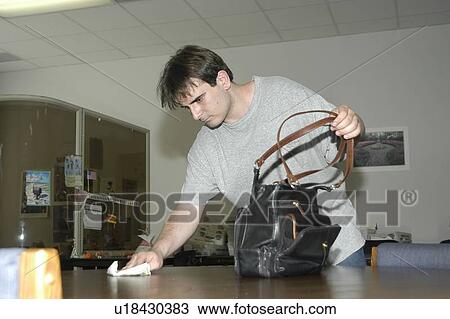 A man with a disability is working in an office cleaning the computer. View Large Photo Image Stock Image - A man with a disability is working in an office cleaning the computer.. Fotosearch