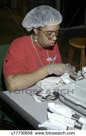 A woman with a disability working in food service. View Large Photo Image Stock Photo - A woman with a disability working in food service.. Fotosearch