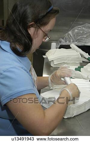 Close up image of a woman with DownÆs Syndrome prepping silverware at a restaurant. View Large Photo Image Stock Image - Close up image of a woman with DownÆs Syndrome prepping silverware at a restaurant.. Fotosearch