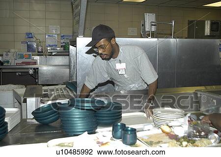Man with disabilities in a commercial kitchen washing dishes. View Large Photo Image Stock Image - Man with disabilities in a commercial kitchen washing dishes.. Fotosearch