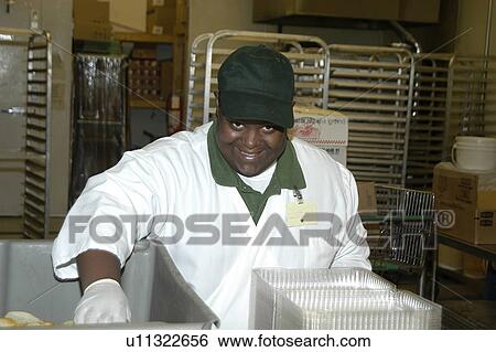 Man with disabilities working in a food store. View Large Photo Image Stock Photograph - Man with disabilities working in a food store.. Fotosearch