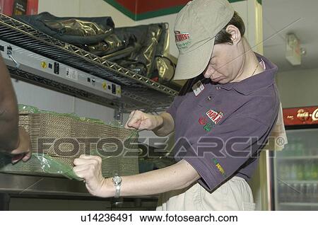 Man with disabilities working in the kitchen at a pizza place. View Large Photo Image Stock Image - Man with disabilities working in the kitchen at a pizza place.. Fotosearch