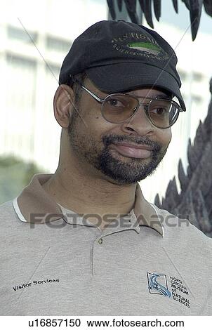 Stock Image - Smiling face of a man with disabilities.. Fotosearch