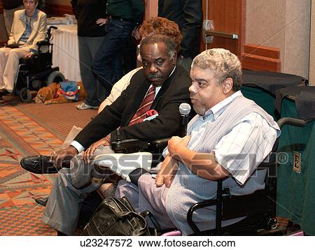 A man with disabilities speaking at a disability rights activists conference. View Large Photo Image Stock Image - A man with disabilities speaking at a disability rights activists conference.. Fotosearch
