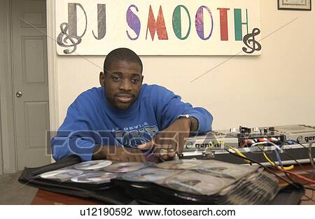 African-American man with multiple disabilities, preparing for his next gig - as a DJ for a local dance - a small business or micro-enterprise he started to produce income while living his dream of being a DJ. View Large Photo Image Stock Image - African-American man with multiple disabilities, preparing for his next gig - as a DJ for a local dance - a small business or micro-enterprise he started to produce income while living his dream of being a DJ.. Fotosearch