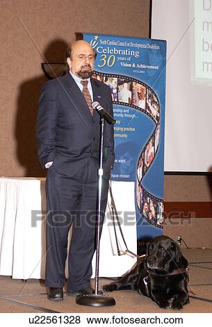 Stock Photo - President of the American Association of People with Disabilities speaking to a gathering of people with disabilities.. Fotosearch