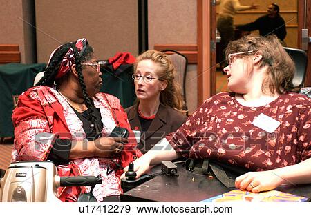 Three women, two with disabilities, reflecting and chatting during a break at a disability rights conference. View Large Photo Image Stock Photo - Three women, two with disabilities, reflecting and chatting during a break at a disability rights conference.. Fotosearch