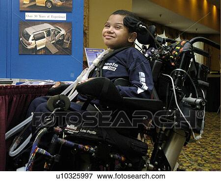 Young boy with significant disabilities getting around in the community with help from cutting edge assistive technology. View Large Photo Image Stock Photo - Young boy with significant disabilities getting around in the community with help from cutting edge assistive technology.. Fotosearch