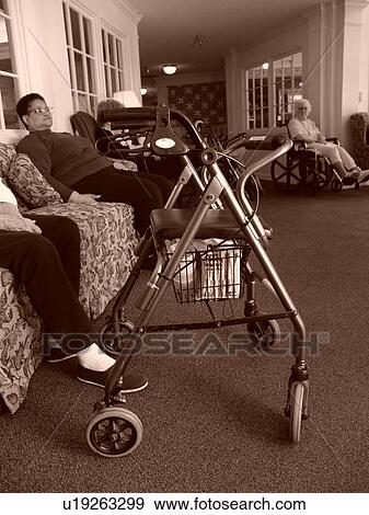 An elderly women have some quit time while in a nursing home. View Large Photo Image Stock Photo - An elderly women have some quit time while in a nursing home.. Fotosearch