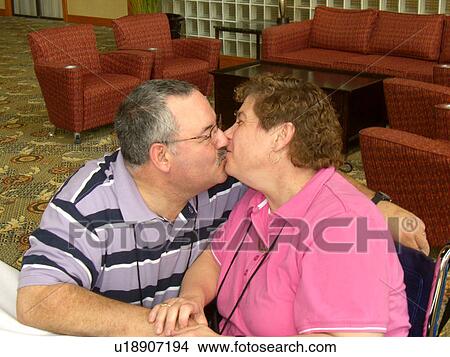 Man and woman both with a developmental disability kissing! View Large Photo Image Picture - Man and woman both with a developmental disability kissing!. Fotosearch
