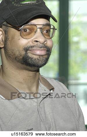 Stock Photo - Smiling face of a man with disabilities.. Fotosearch