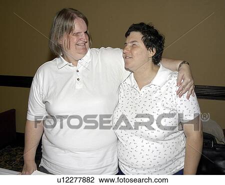Stock Image - Two friends, both blind, having a nice time together.. Fotosearch