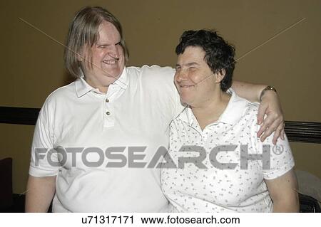 Stock Image - Two friends, both blind, having a nice time together.. Fotosearch
