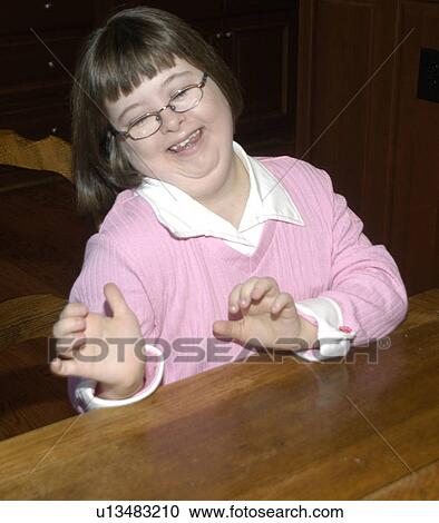 Girl with Down Syndrome clowning around and having fun. View Large Photo Image Stock Image - Girl with Down Syndrome clowning around and having fun.. Fotosearch