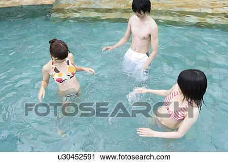 Friends playing in swimming pool, Saipan View Large Photo Image Stock Image - Friends playing in swimming pool, Saipan. Fotosearch