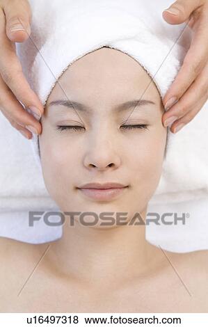 Young woman getting a facial massage, Saipan View Large Photo Image Stock Photo - Young woman getting a facial massage, Saipan. Fotosearch