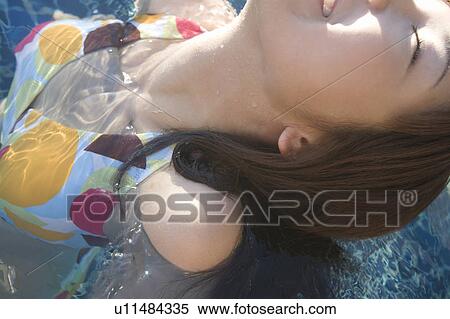 Young woman in a swimming pool, Saipan View Large Photo Image Stock Photography - Young woman in a swimming pool, Saipan . Fotosearch