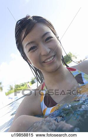 Young woman in a swimming pool, Saipan View Large Photo Image Stock Photography - Young woman in a swimming pool, Saipan . Fotosearch
